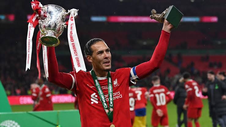 Virgil van djik with trophy